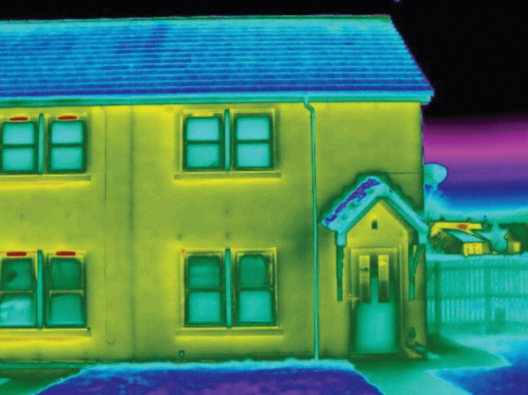 Well insulated house at night in thermal imaging